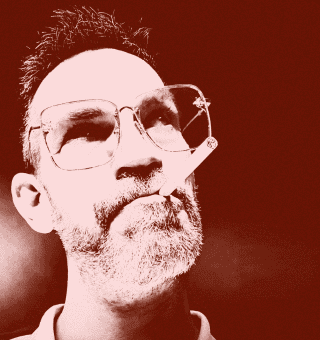 Mr. Berger performing with microphone at BudenMusik event.